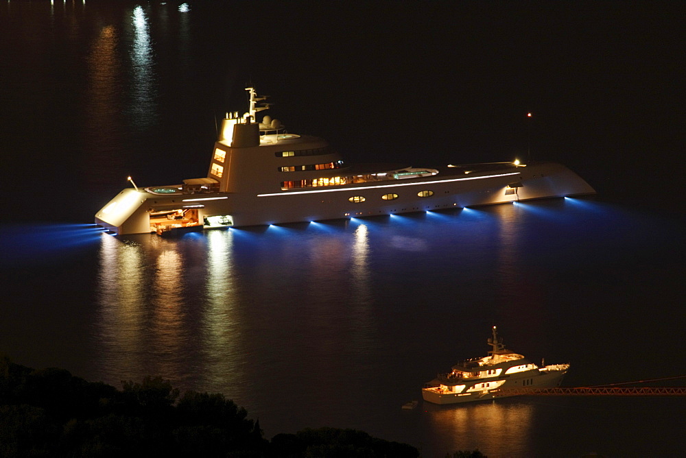 Motor yacht A, also called "Sigma" or "SF 99" during the planning and construction period, length 119 m, built in 2008, shipyard and architect Blohm & Voss GmbH, architect Francis Design, design Philippe Starck, owner Andrey Melnichenko, at night, Monaco,