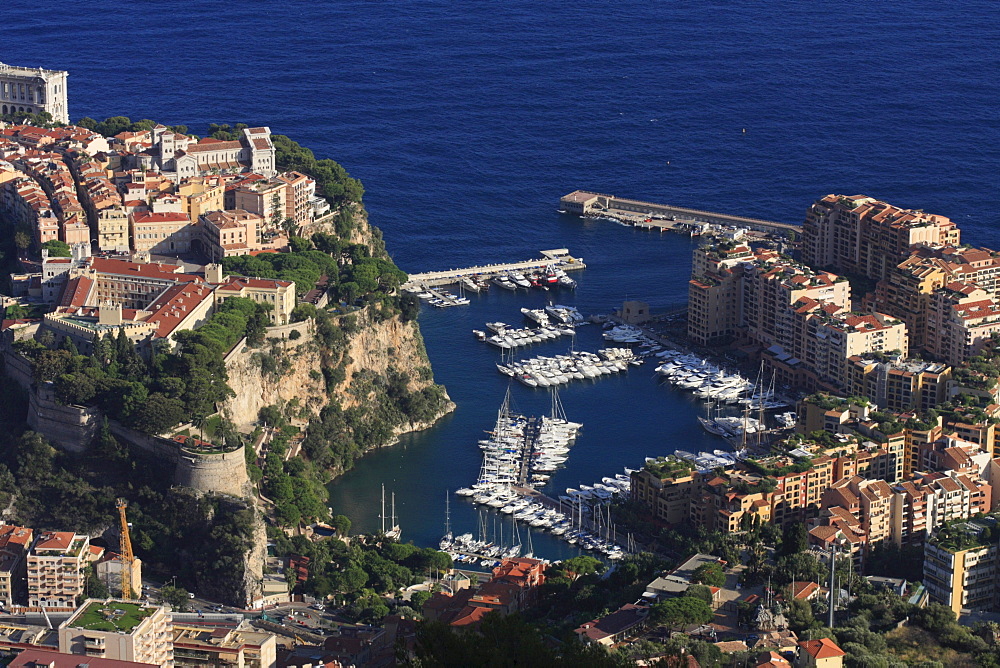 Port Fontvieille with superyachts between the historic town centre of Monaco with Prince's Palace and the Cathedral and the newer district of Fontvieille, Principality of Monaco, Cote d'Azur, Europe