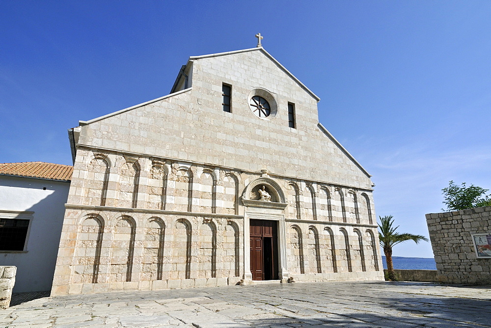 Arched west front facade of Church, Cathedral, of St Mary the Great, Crkva svete Marije Velike, in historic town of Rab, Croatia, Europe