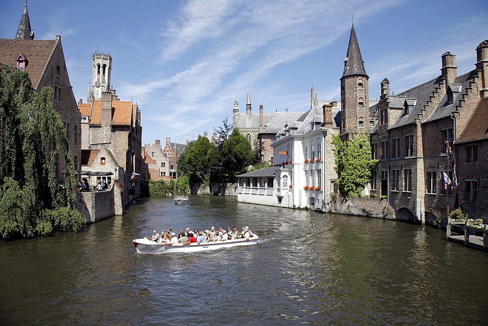 Boat tour through canals, historic center of Bruges, Flanders, Belgium, Europe