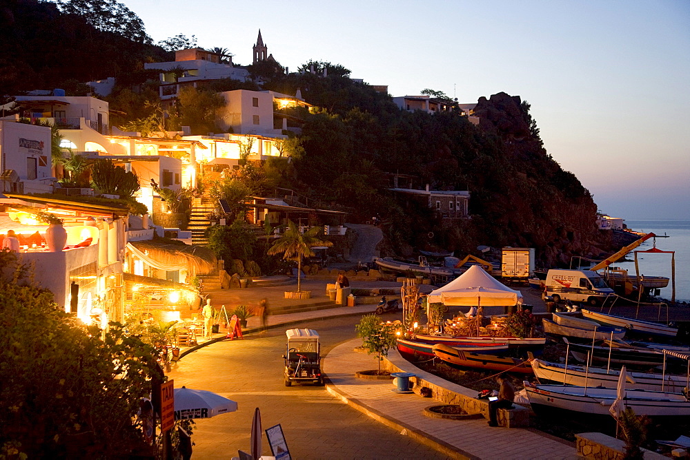 Promenade with restaurants and cafes at night, harbor of Panarea island, Aeolian Islands, Sicily, Italy, Europe