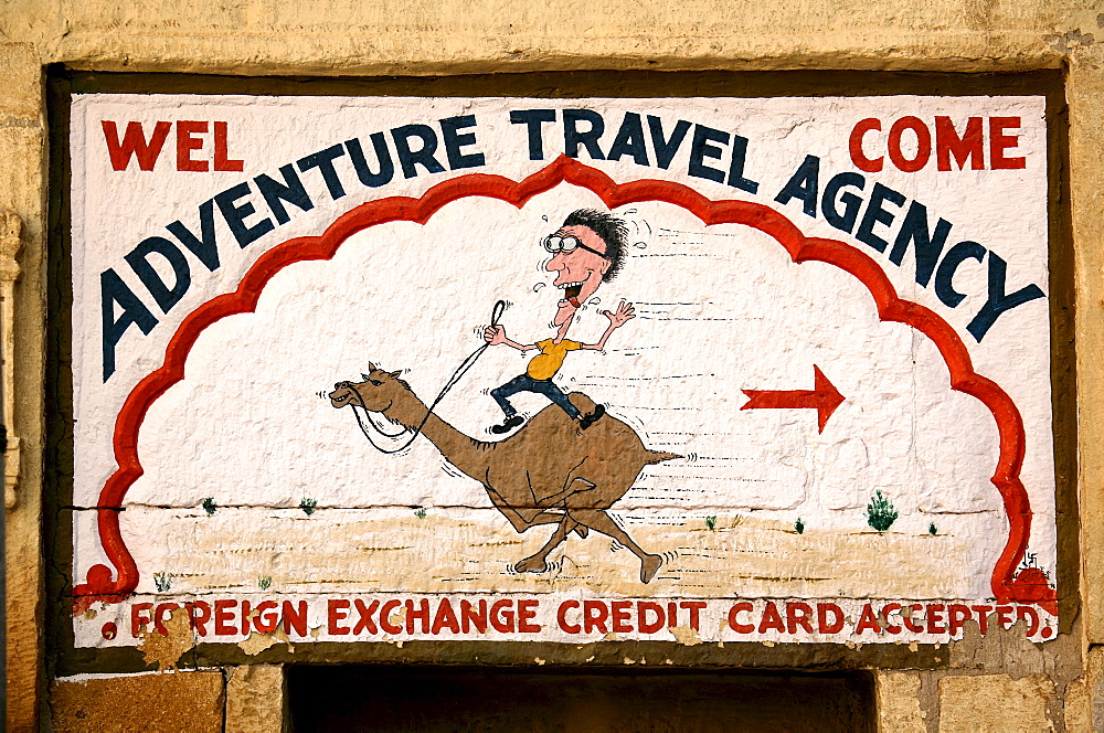 Advertising sign of an Indian travel agent for a camel safari in Jaisalmer, Rajasthan, India, Asia