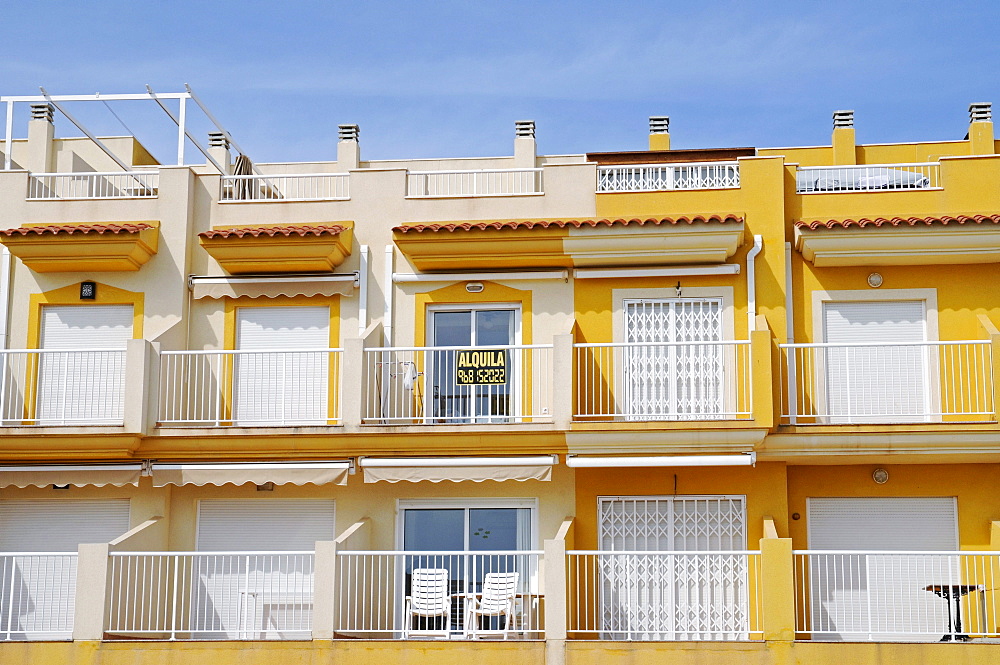 For rent, town houses, balconies, yellow, empty, chairs, Isla Plana, Puerto de Mazzaron, Costa Calida, Murcia, Spain, Europe