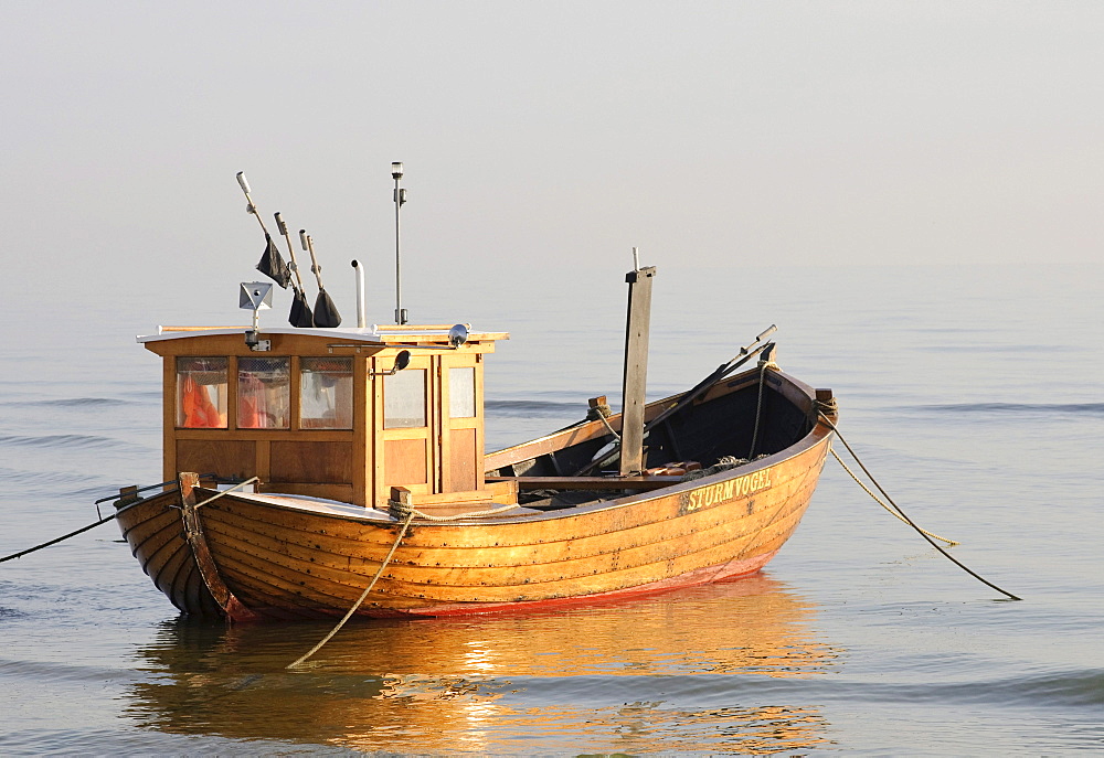 Fishing boat on the beach in the seaside resort of Heringsdorf in morning light, Usedom Island, Mecklenburg-Western Pomerania, Germany, Europe