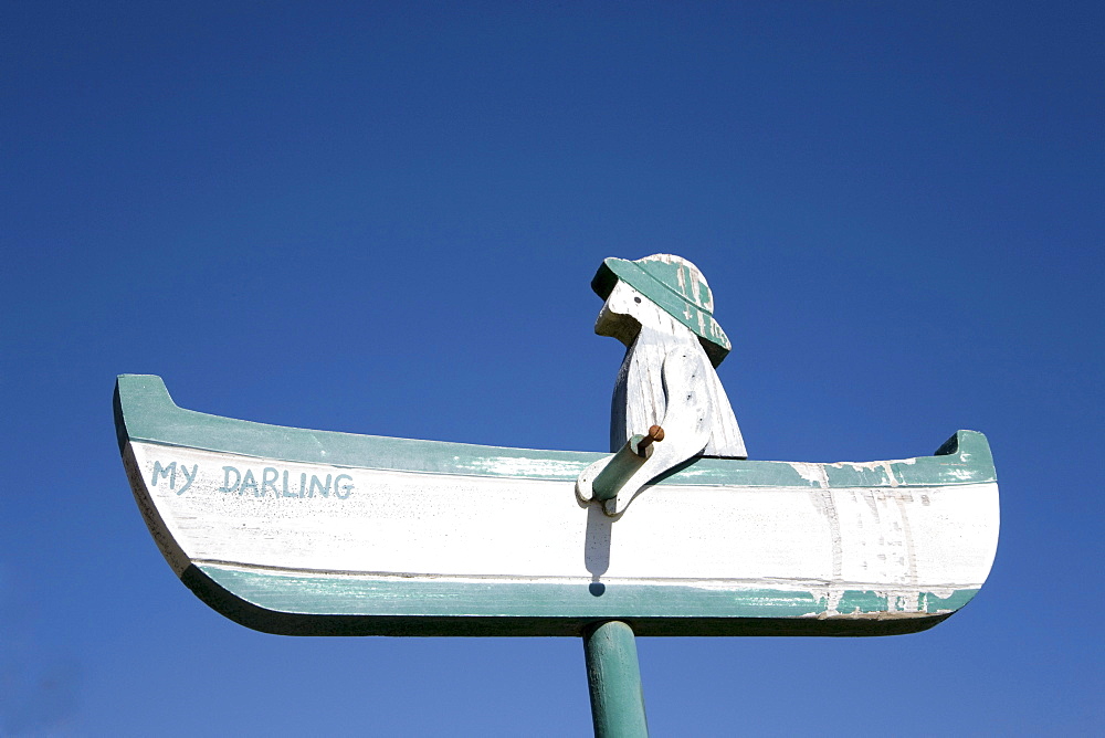 Fisherman in his boat as a woodcarving, Schleswig-Holstein, Northern Friesland, Northern Germany, Germany, Europe