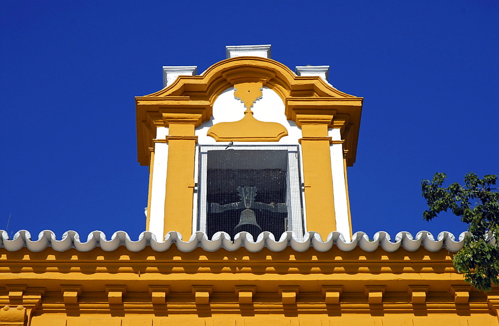 A colorful dormer with a bell, Seville, Spain, Europe