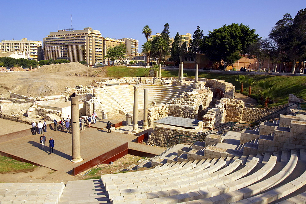 Tourists at the Roman amphitheatre, Alexandria, Egypt, Africa