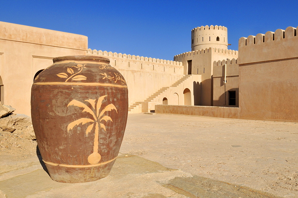 Historic adobe fortification, watchtower of Sunaysilah Castle or Fort in Sur, Al Sharqiya Region, Sultanate of Oman, Arabia, Middle East