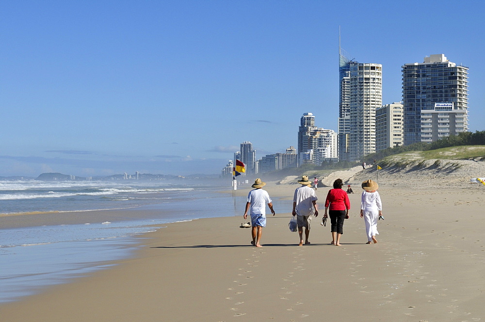 People walking on the beach at Surfers Paradise, Gold Coast, Queensland, Australia