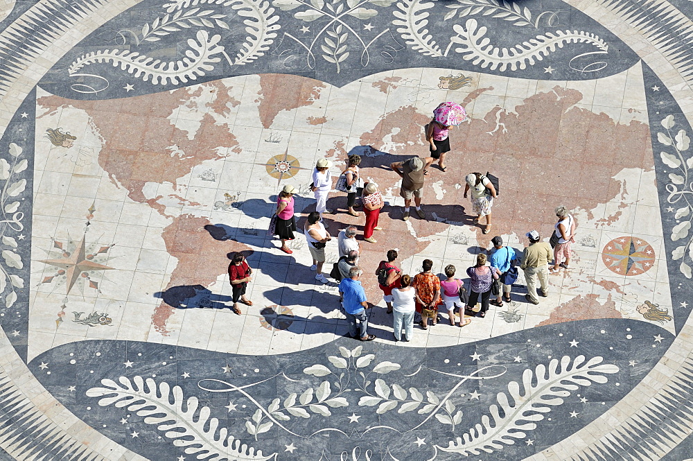 Tourists on a giant world map at the foot of the Monument to the Discoveries, Padrao dos Descobrimentos, Belem, Lisbon, Portugal, Europe