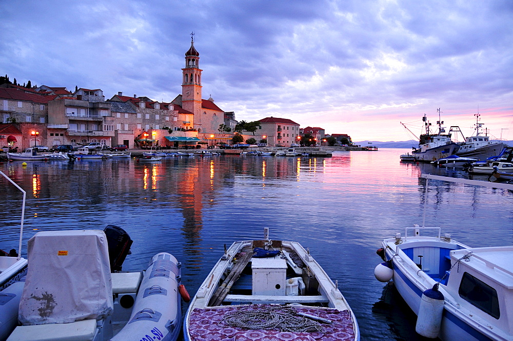 Fishing boats in the harbor of Sutivan in front of the church Sveti Ivan, Island Brac, Dalmatia, Croatia, Balkans, Europe