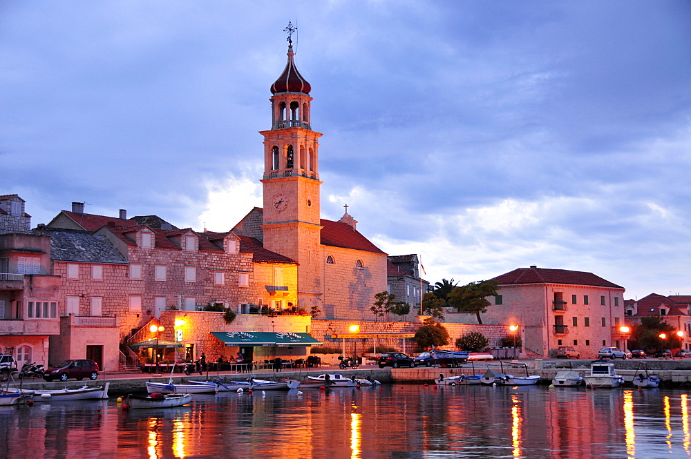 Fishing boats in the harbor of Sutivan in front of the church Sveti Ivan, Island Brac, Dalmatia, Croatia, Balkans, Europe