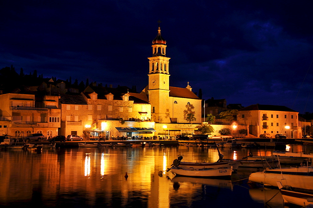 Fishing boats in the harbor of Sutivan in front of the church Sveti Ivan, Island Brac, Dalmatia, Croatia, Balkans, Europe