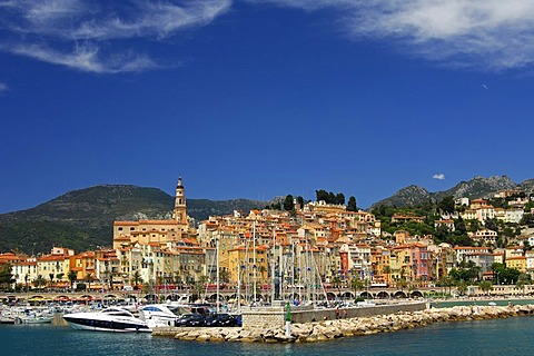 The old port with the impressive backdrop of Menton old town and the Baroque St. Michel's church, Cote d'Azur, France