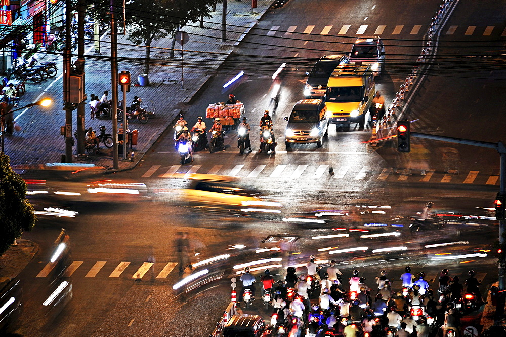 Road junction with traffic at night, Ho Chi Minh City, Saigon, Vietnam, Asia