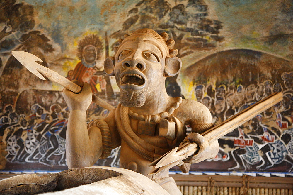 Woodcarved warrior in the Tam-Tam House, Foumban, Cameroon, Africa