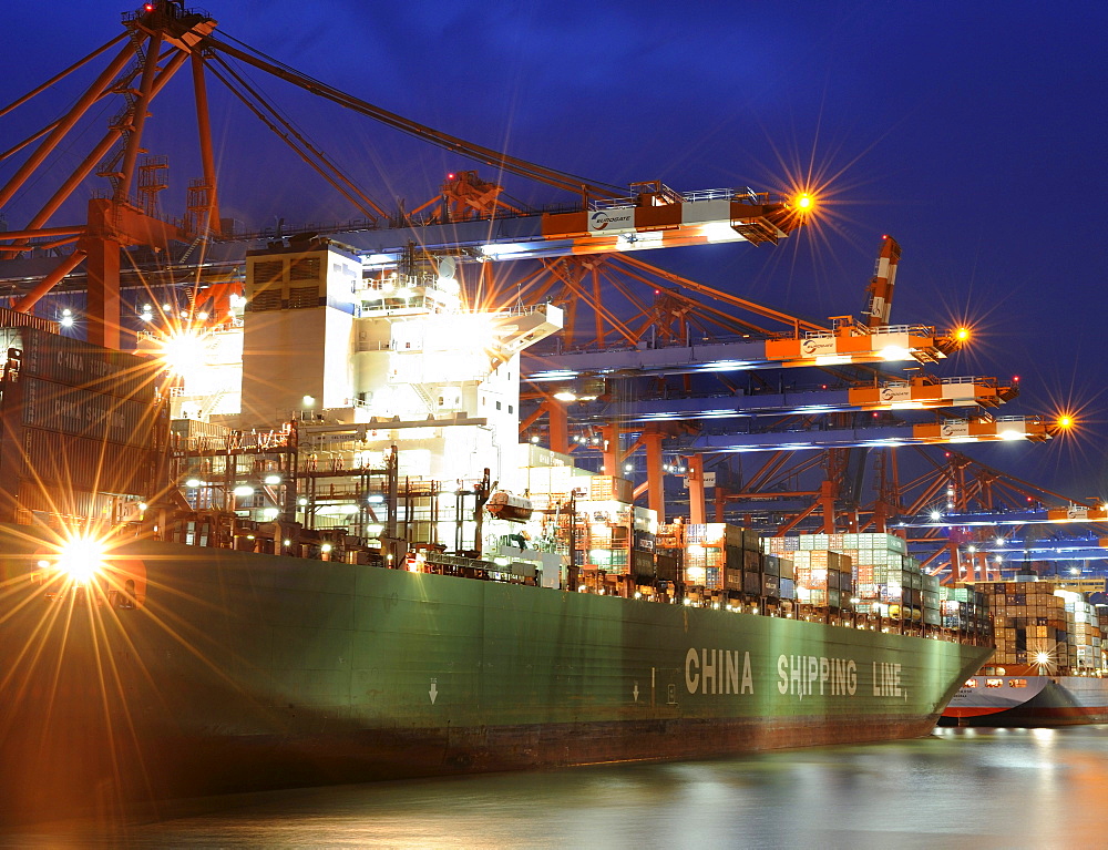 Loading a container ship at the Eurogate terminal, Hamburg, Germany, Europe