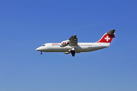 Swiss Air airplane Swiss Avro Regional Jet RJ100 is swinging out its landing gear