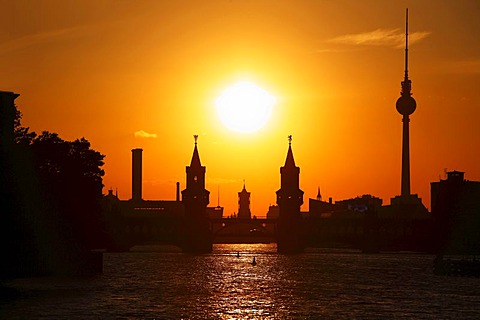 Sunset above Spree River, Oberbaumbruecke Bridge, Berlin town hall, television tower, Berlin, Germany