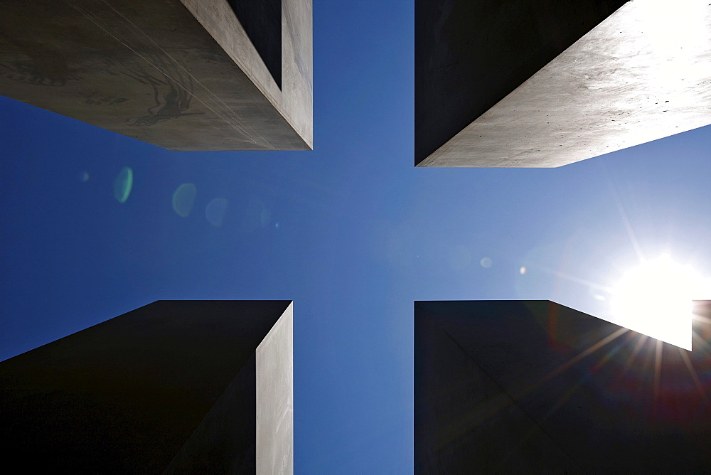 Sun over the concrete slabs or stelae at the Memorial to the Murdered Jews of Europe, Berlin, Germany, Europe