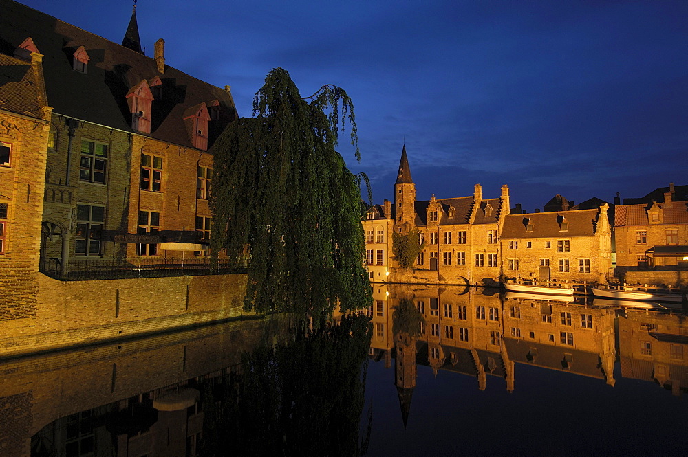 Water reflection on River Dijver at dusk, Bruges, Flanders, Belgium, Europe