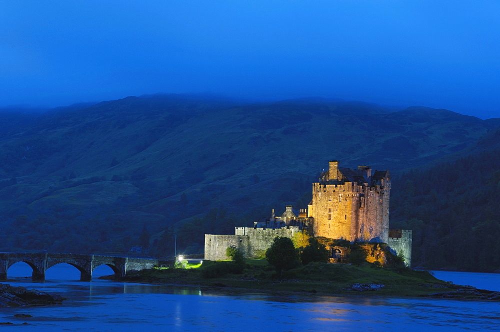 Eilean Donan castle and Loch Duich at dusk, Highlands Region, Scotland, United Kingdom, Europe