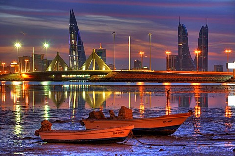 Skyline of the Corniche as seen from King Faisal Highway, Muharraq side, World Trade Center buildings, left, beside the towers of the Financial Harbour Complex, Muharriq Bridge at the Sheikh Isa Causeway, capital city, Manama, Kingdom of Bahrain, Persian 