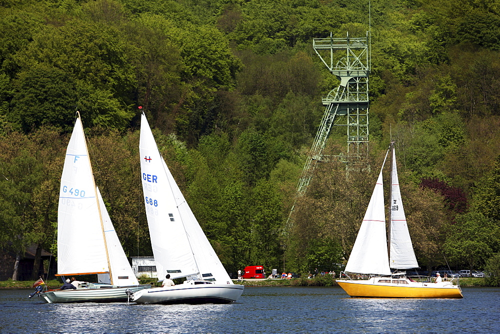 Former coal mine winding tower of mine Carl Funke, water sports on the Baldeneysee storage lake, river Ruhr, Essen, North Rhine-Westphalia, Germany, Europe