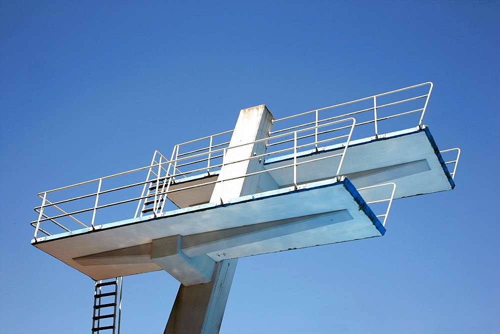 Diving tower with a 10-meter diving board in an outdoor pool