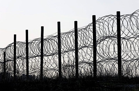 Fence, secured with NATO wire, barbed wire