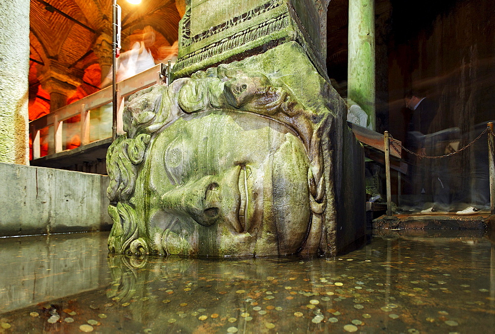 Monumental head of a medusa at the foot of a column, Yerebatan Sarayi, Byzantine cistern, Sultanahmet, Istanbul, Turkey