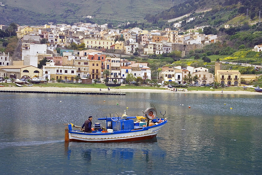 Fisherman and fishing boat at harbor Castellammare del Golfo, Sicily, Italy, Europe