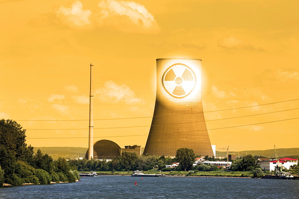 The closed nuclear power plant in Muehlheim-Kaerlich on Rhine River, composing, symbolic picture, radioactivity warning sign