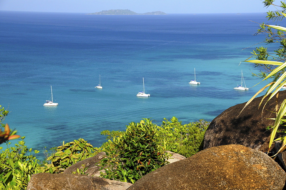 Sailing boats in front of the Anse Volbert, Cote d'Or, Praslin Island, Seychelles, Africa, Indian Ocean