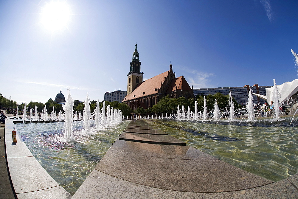 Brunnen der Voelkerfreundschaft' Fountain, Marienkirche Church in the back, taken with a fisheye lens, Berlin-Mitte, Germany, Europe