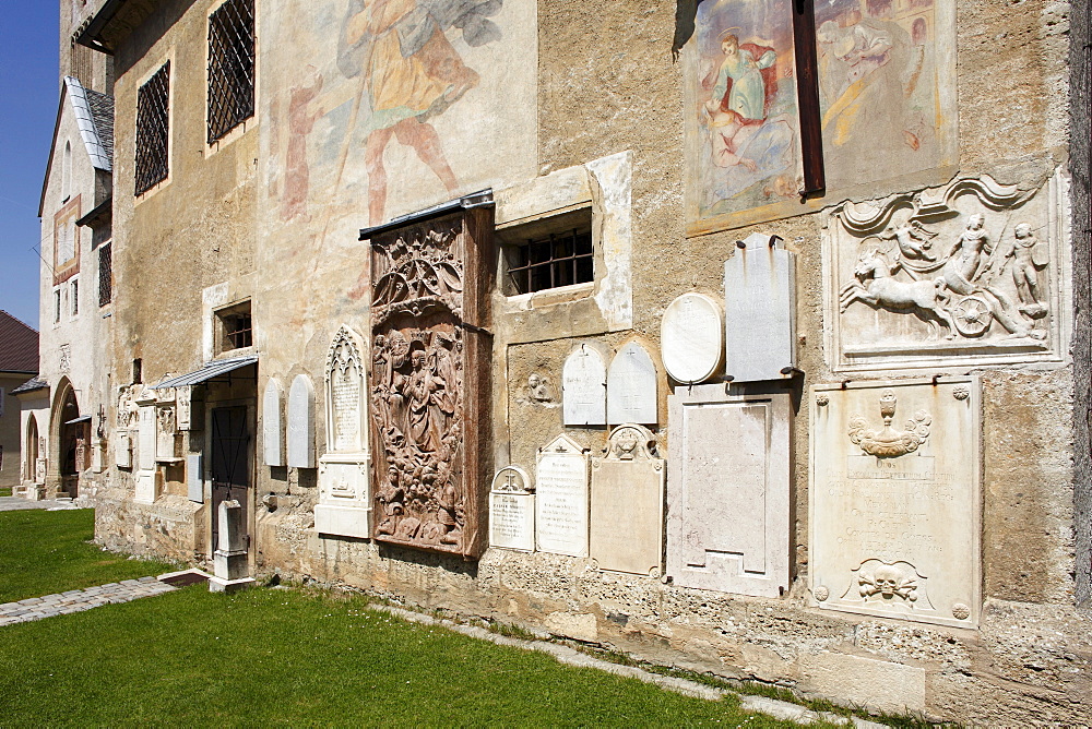 South wall of the pilgrimage church Mary Saal with tombstones and reliefs, Carinthia, Austria, Europe