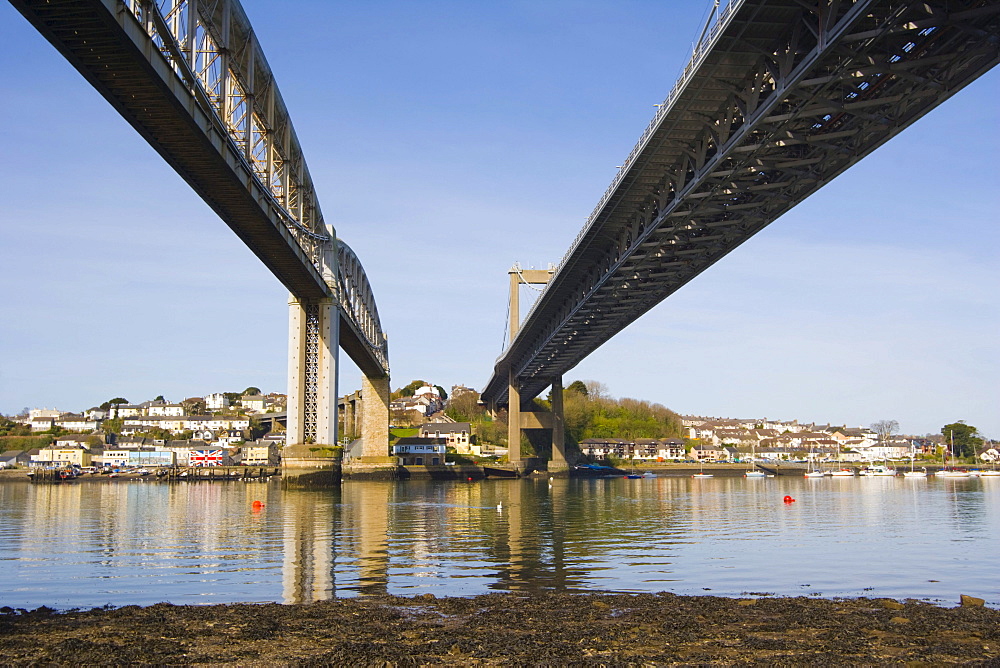 Royal Albert Bridge and Tamar Bridge with river Tamar against Saltash riverside from Saltash Passage, Plymouth, between Cornwall and Devon, England, United Kingdom, Europe