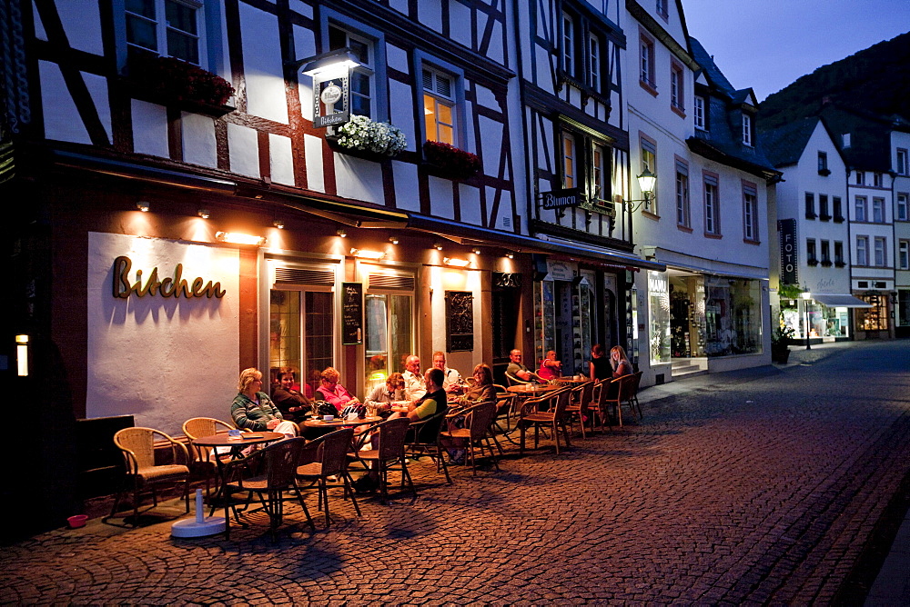 Tourists sitting at night in the restaurant at the Hebegasse lane, Bernkastel-Kues, Mosel river, Rhineland-Palatinate, Germany, Europe