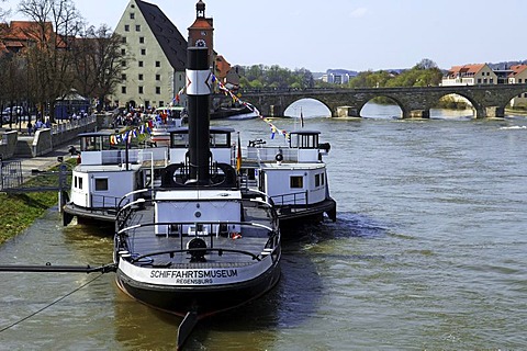 Maritime museum on Danube River, Historische Wurstkueche Restaurant and Steinerne Bruecke Bridge in the back, Regensburg, Upper Palatinate, Bavaria, Germany, Europe