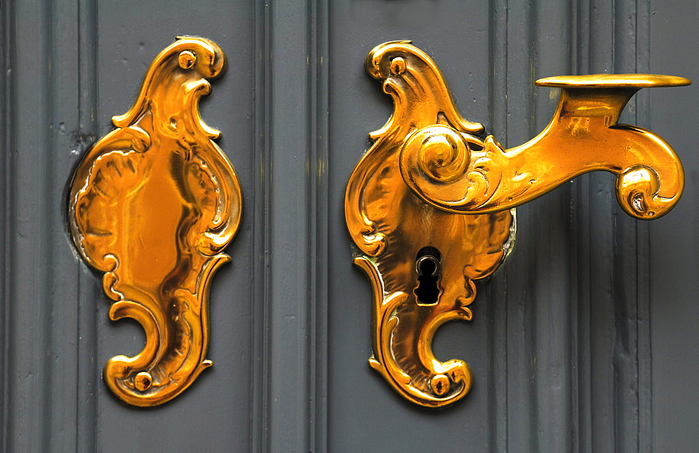 Old decorative brass door handle, Lueneburg, Lower Saxony, Germany, Europe