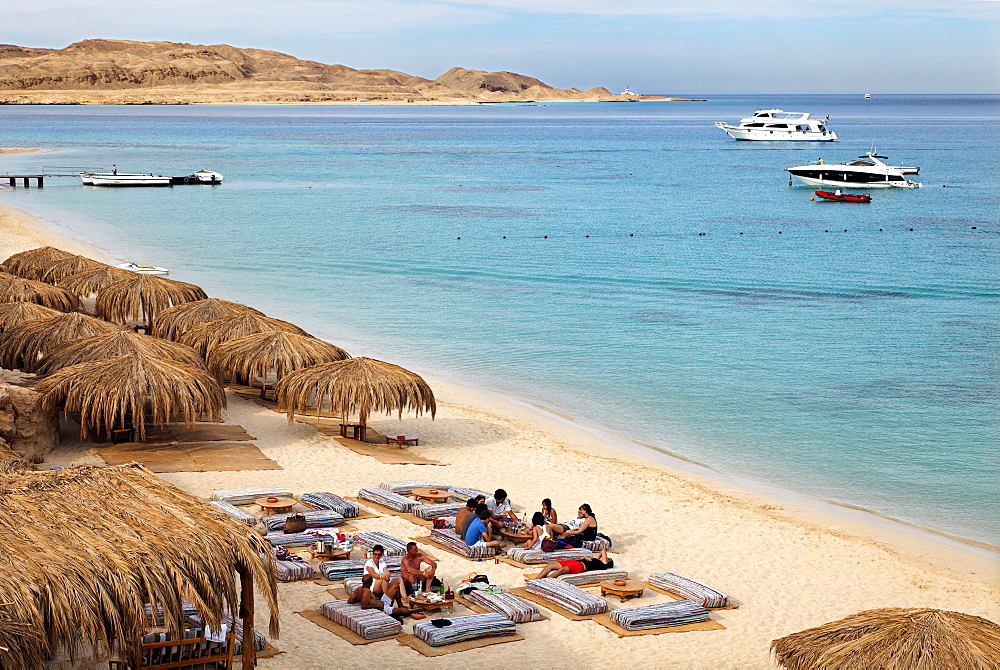 People at beach on pillow seats, beach, parasols, lagoon, swimmers, people, ships, Beach Mahmya, beach, Giftun Island, Hurghada, Egypt, Africa, Red Sea