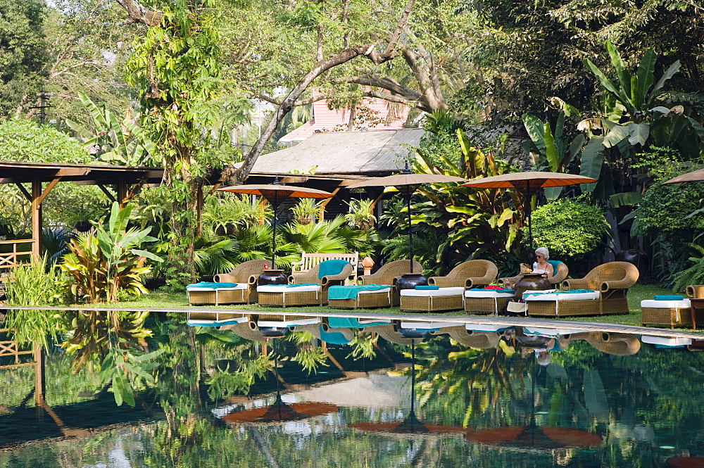 Deckchairs reflecting in the pool, The Governors Residence, luxury hotel, colonial hotel, Rangoon, Yangon, Burma, Myanmar, Asia