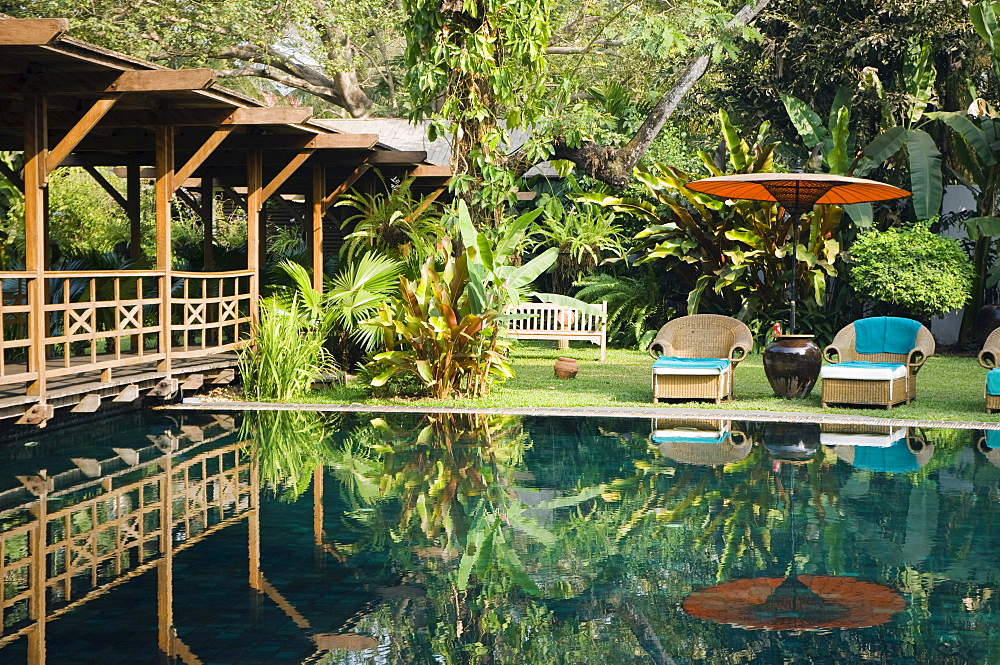 Deckchairs reflecting in the pool, The Governors Residence, luxury hotel, colonial hotel, Rangoon, Yangon, Burma, Myanmar, Asia