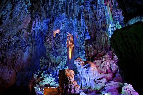 Colourful illumination in the largest stalactite cave of Guilin, the Reed Flute Cave, Guilin, Guangxi, China, Asia