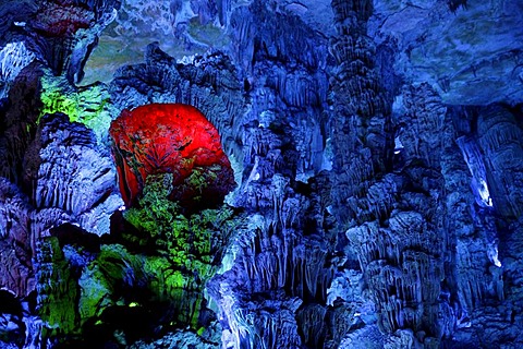 Varied lighting in the largest stalactite cave of Guilin, the Reed Flute Cave, Guilin, Guangxi, China, Asia