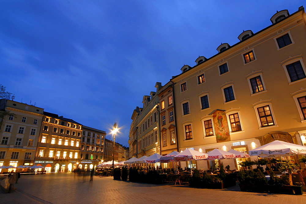 Restaurants on the main or grand market square Rynek Glowny at night, Cracow, Poland