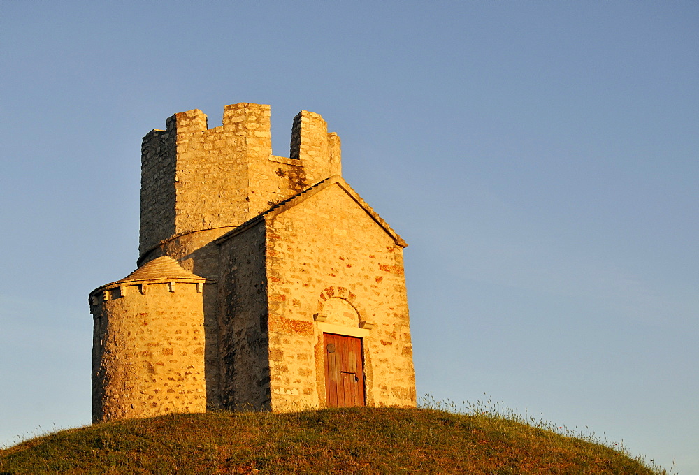 Romanesque St. Nicolas Church located on earthen hill in fields of Prahulje near Nin in Dalmatia, Croatia, Europe