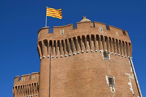 Catalan flag above the city gate "Le Castillet", Perpignan, Pyrenees-Orientales, Roussillon, Languedoc-Roussillon, South France, France