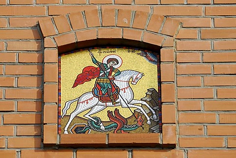 Orthodox icon of Saint George on red brick wall