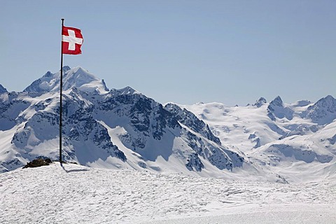 Swiss national flag on the plateau Trais Fluors, St. Moritz, Oberengadin, Graubuenden, Switzerland